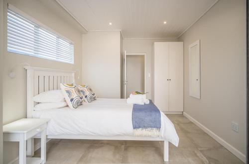 Ένα ή περισσότερα κρεβάτια σε δωμάτιο στο Fork West Holiday Apartments
