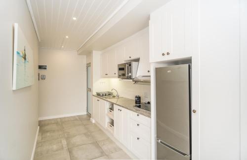 Η κουζίνα ή μικρή κουζίνα στο Fork West Holiday Apartments