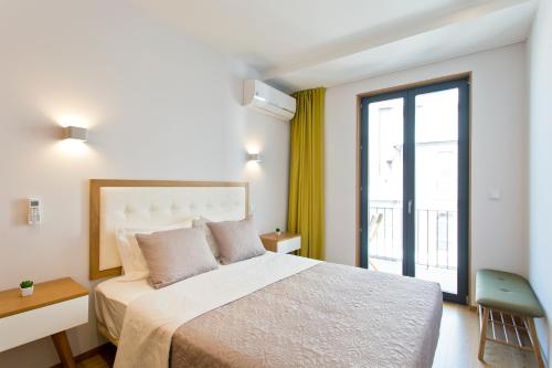Кровать или кровати в номере OTF- Porto Centro