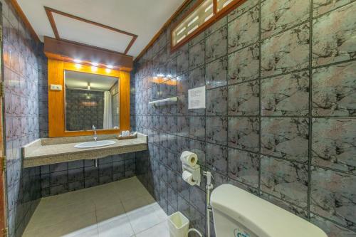 Ett badrum på Panda Hotel