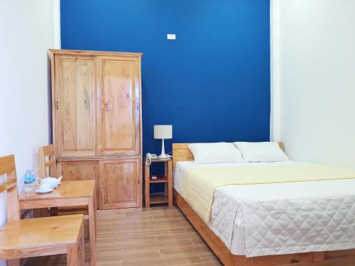 Postel nebo postele na pokoji v ubytování Phú tài center hotel
