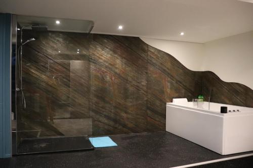 a bathroom with a shower and a sink at Les pièces du puzzle in Dunkerque