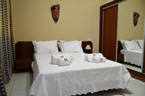 Ένα ή περισσότερα κρεβάτια σε δωμάτιο στο Hotel Central