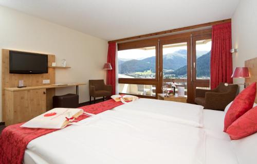 Postel nebo postele na pokoji v ubytování Central Sporthotel Davos