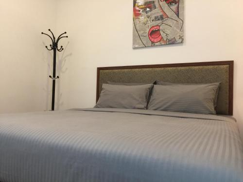 a bedroom with a large bed with at Afiniti Muslim Medini Condo in Nusajaya