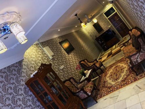 an overhead view of a living room with chairs at Bayan Baru Homestay @ Taman Sri Nibong in George Town