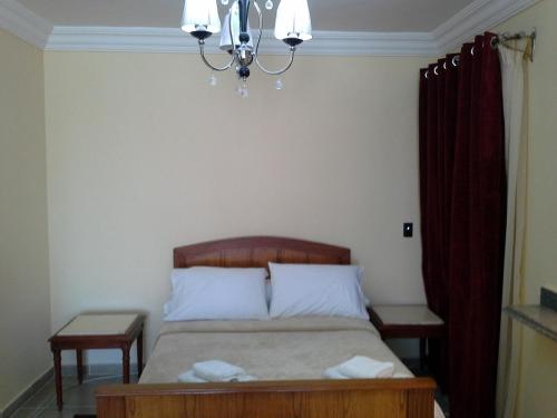 Postel nebo postele na pokoji v ubytování Alexander The Great Hotel