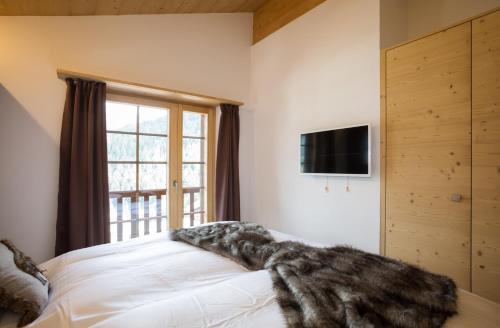 Postel nebo postele na pokoji v ubytování Tenaya