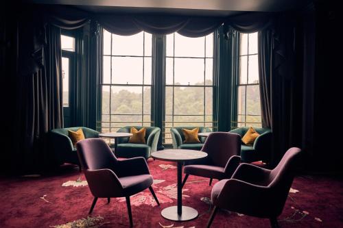 a waiting room with chairs and tables in front of a window at Avon Gorge by Hotel du Vin in Bristol