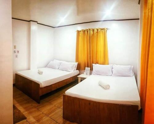 A bed or beds in a room at Bella Vita Guest House