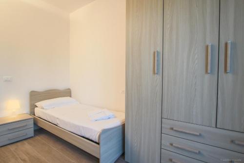 a small bedroom with a bed and a closet at Santa Caterina in Levanto