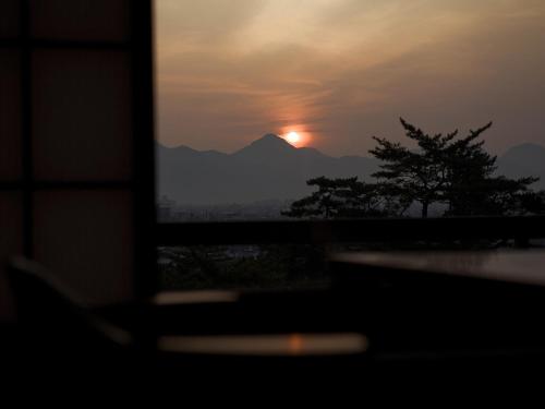a view of the sunset from a computer screen at Kotohira Kadan in Kotohira