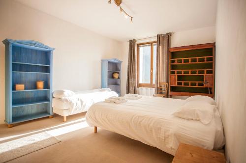 Кровать или кровати в номере Vieux Palais - Chamonix