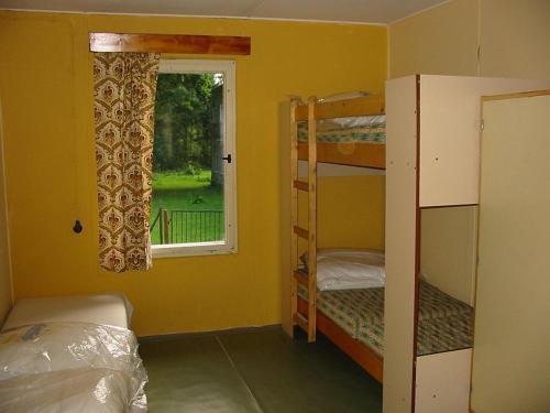 Postel nebo postele na pokoji v ubytování Camping Karolina