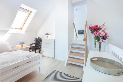 a bedroom with a bed and a bath tub at FEWO Reitanlage bei Altefähr in Rambin