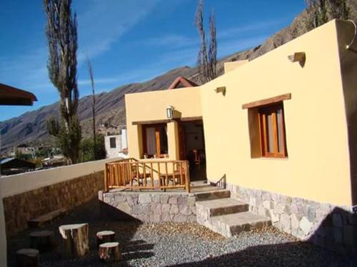 a small house with a staircase in front of it at Rinconcito en Tilcara in Tilcara