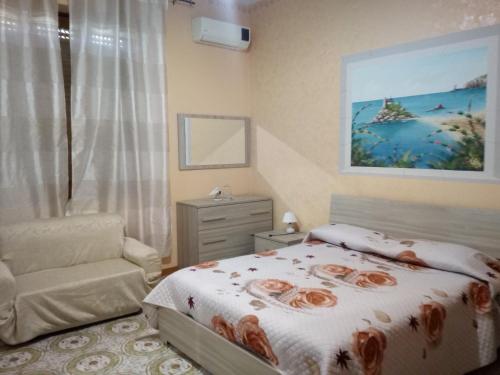 Postel nebo postele na pokoji v ubytování Beb I Delfini Di Casa Paola