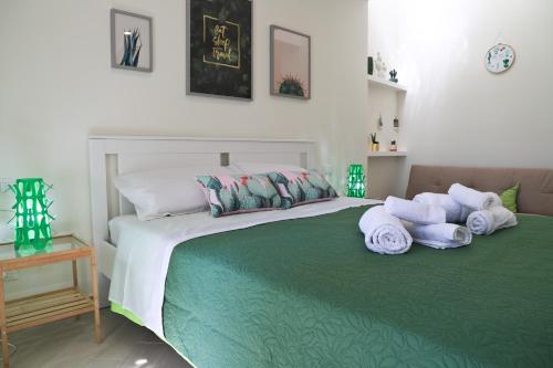 a bedroom with a bed with towels on it at centruMassimo b&b in Palermo