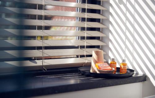 a counter with a plate of food and condiments at Boutique Hotel Bellevue in Blaricum