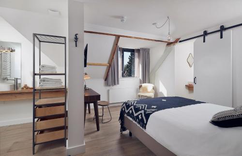 Postel nebo postele na pokoji v ubytování Boutique Hotel Bellevue