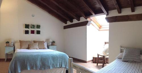 Postel nebo postele na pokoji v ubytování El Tombo de Santa Catalina