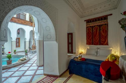 Postel nebo postele na pokoji v ubytování Riad Safran et Cannelle & Spa