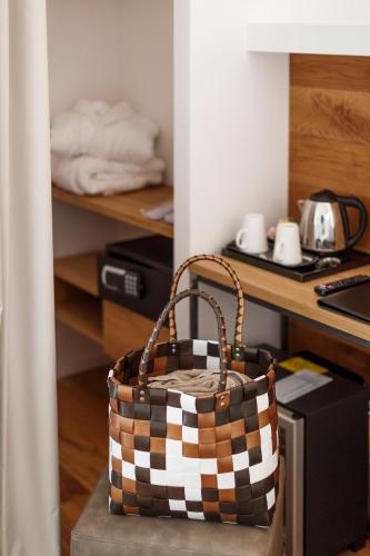 a brown and white checkered bag sitting on a counter at ALEA - Garda Lake Suite in Arco