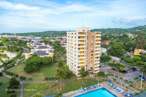 an aerial view of a building and a pool at Turtle Beach Towers in Ocho Rios