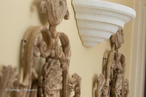 a mirror with a towel hanging on a wall at Turtle Beach Towers in Ocho Rios