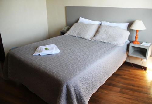 Postel nebo postele na pokoji v ubytování Opera Hotel