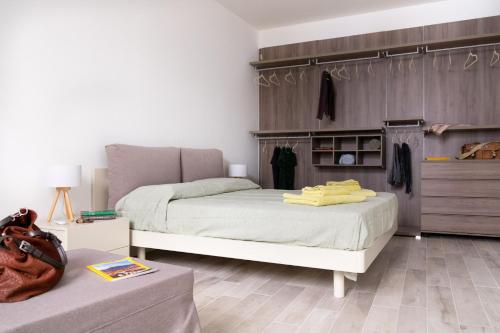a bedroom with two beds and a dresser at Vasa Vasa Home in Palermo