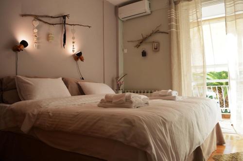 A bed or beds in a room at Luxury Beach Apartment in Athens Riviera