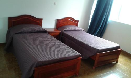 Кровать или кровати в номере Casa Amarela