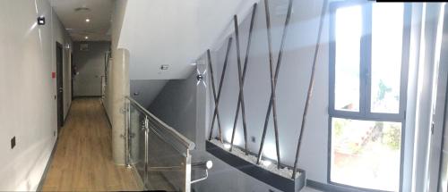 a staircase in a building with a window at H La Cabaña in Pozuelo de Alarcón