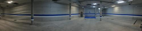 an empty gym with blue stripes on the walls at H La Cabaña in Pozuelo de Alarcón