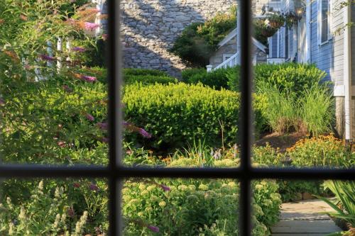 a view from a window of a garden at L'Auberge Provencale Inn & Restaurant in Boyce