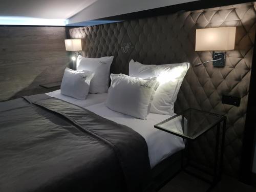 Кровать или кровати в номере Hotel Fado
