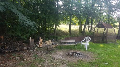 a park with a bench and a gazebo at Bujaków, apartamenty Zdrojowa 58a in Bujaków