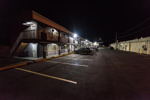 a car parked in a parking lot at night at Olympia Lodge in Calgary