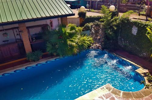 Piscina en o cerca de Si Mi Capitán - Cabañas & Habitaciones