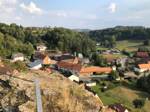 an aerial view of a small village on a hill at Ferienwohnungen Arnstein in Waldeck