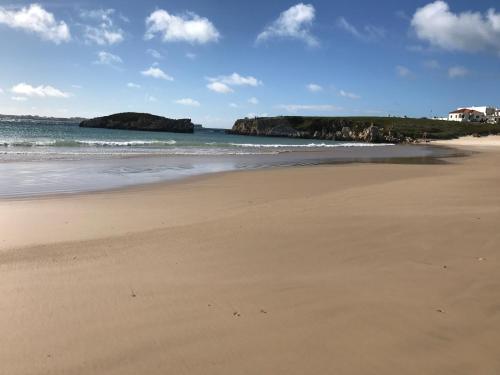 a sandy beach with a view of the ocean at The Wave House in Baleal