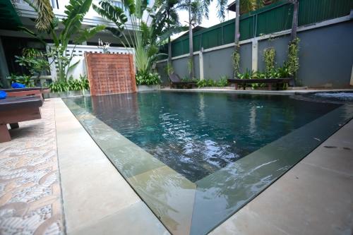 a swimming pool in the middle of a building at Central Night Hotel in Siem Reap