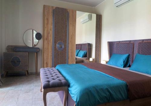 Un pat sau paturi într-o cameră la Bali Residence