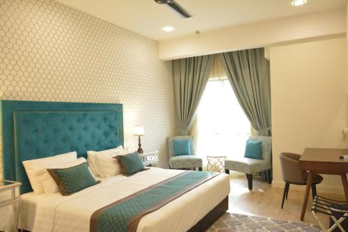 En eller flere senger på et rom på RPGC Garden Hotel