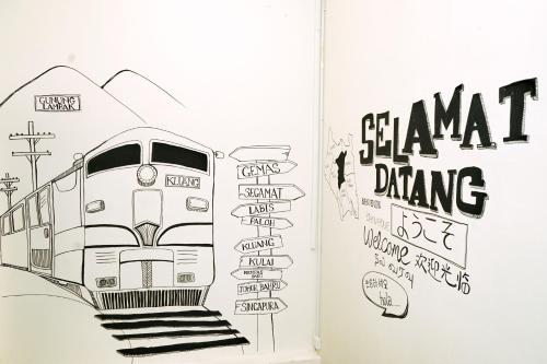 a book with a drawing of a train at B@Home in Kluang