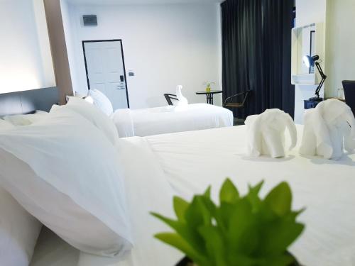 Katil atau katil-katil dalam bilik di Azz Hotel