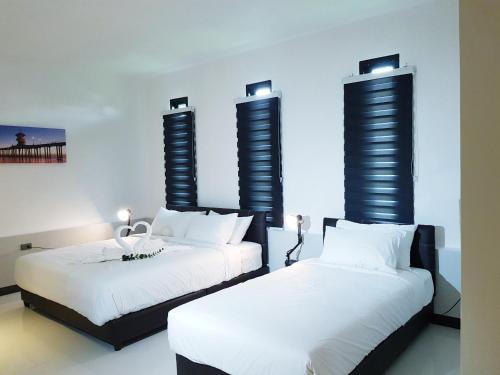 Katil atau katil-katil dalam bilik di Azz Hotel