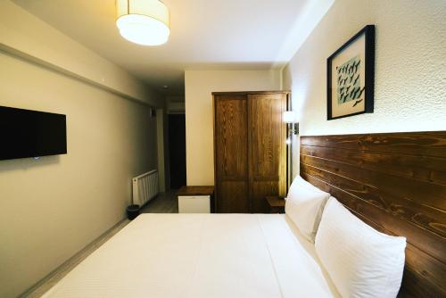 Letto o letti in una camera di 8 Rooms Hotel
