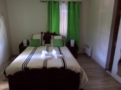 Ένα ή περισσότερα κρεβάτια σε δωμάτιο στο Chambre d'hotes ronquer